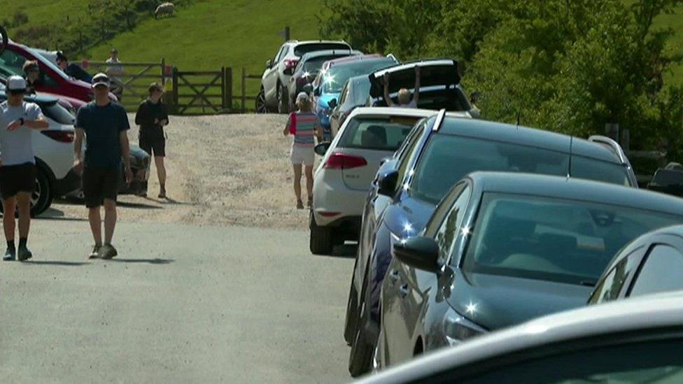 Cars parked along side of road