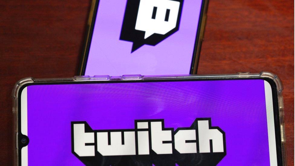 The Twitch logo on a phone screen