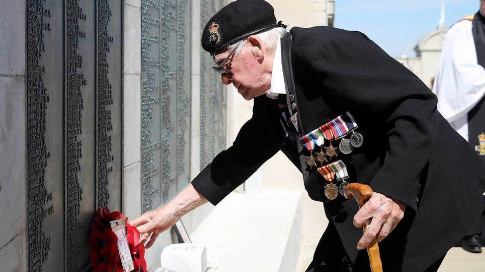 Lawrence Churcher laying a poppy wreath