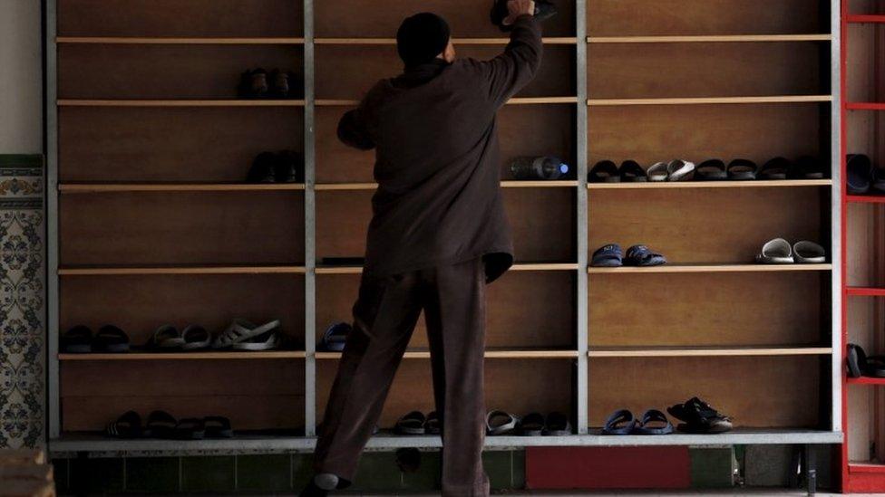 Shoes are stacked at a mosque in Marseilles, 9 January 2016