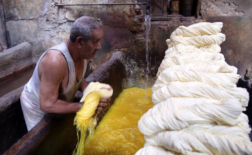 Salama, 76, owner of the tannery, dyes white yarn rolls inside his tannery in Cairo, Egypt, 07 November 2017. Salama started working when he was seven years old during the reign of King Farouk over Egypt because, according to him, the police used to arrest unemployed males of all ages. Now, after almost 70 years, Salama"s tannery is the only one left in the old part of Cairo. The yarn produced is used for shoe laces, mattresses upholstery, ballet dance outfits, and suits.