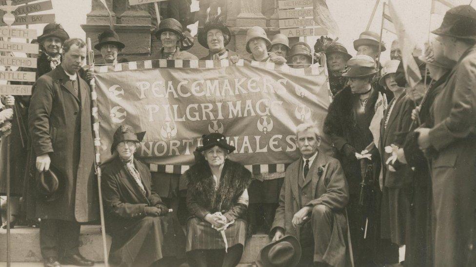 black and white photo of women in 1923 holding a flag