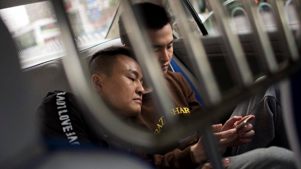 The couple, in the back of a taxi