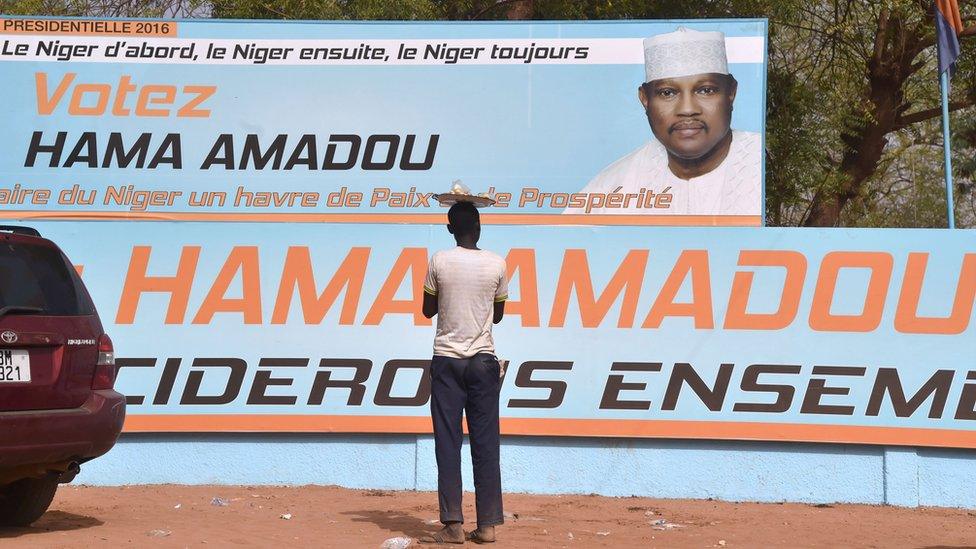 A campaign poster for presidential candidate Hama Amadou ouside Amadou party's headquarters in Niamey