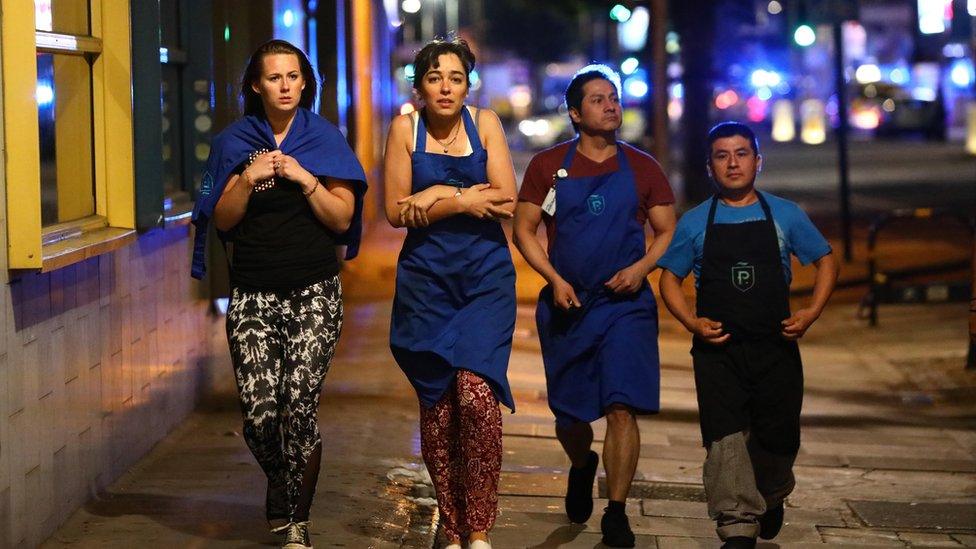 Restaurant staff walking outside Borough Market after the attack