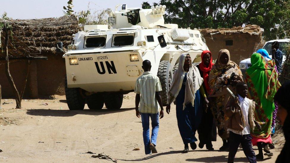 A UN vehicle visits Sudanese refugees to oversee a new cash assistance project implemented by the World Food Program at a UN refugee camp in the city of Nyala, in South Darfur, 9 January 2017