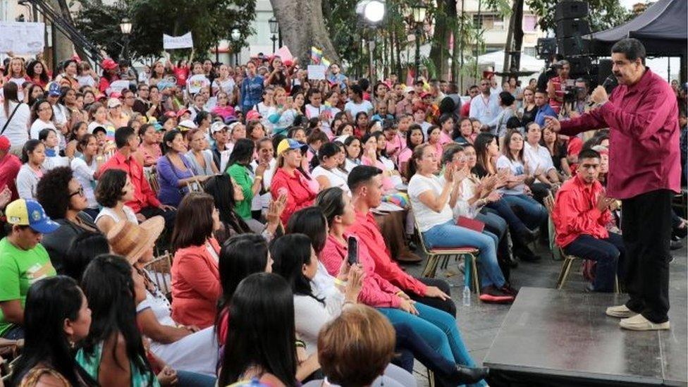 Venezuela's President Nicolas Maduro (R) speaks during an event with women, in Caracas, Venezuela January 25, 2018