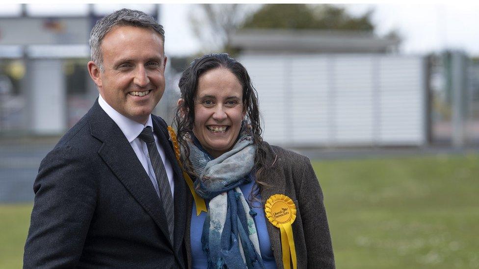 Liberal Democrat Alex Cole-Hamilton and his wife Gillian smile for the cameras