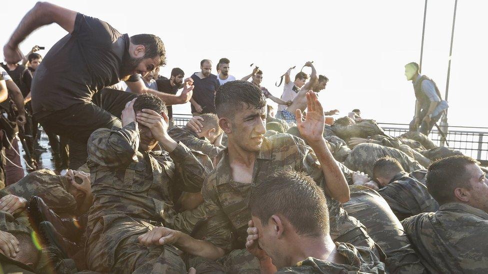 A man kicking soldiers on the Bosphorus Bridge