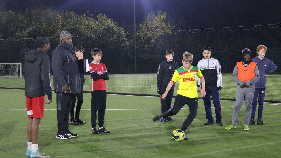 A group of young people in football gear