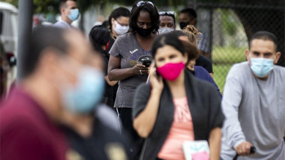 People wait in line to be tested for Covid-19 at a testing site at Lincoln Park in Los Angeles, California