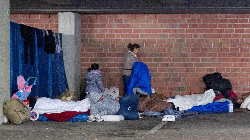 Migrants sleeping rough in a garage in Hamburg, 30 Sep 15