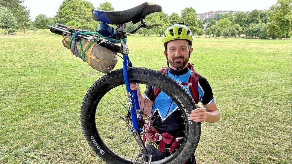 Luke Evison with his unicycle