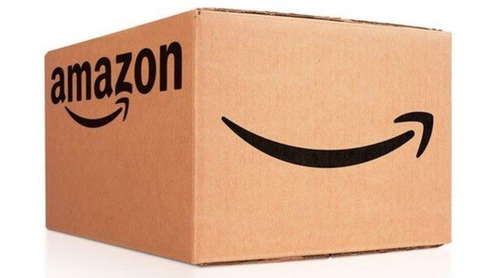 Cardboard box bearing the Amazon smile logo