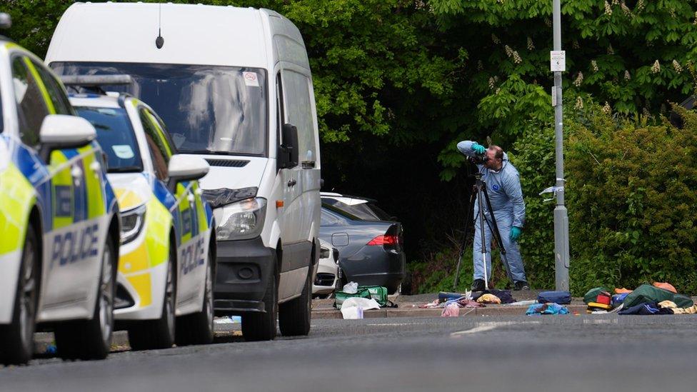 Forensic investigators work at the scene in Laing Close in Hainault, north east London