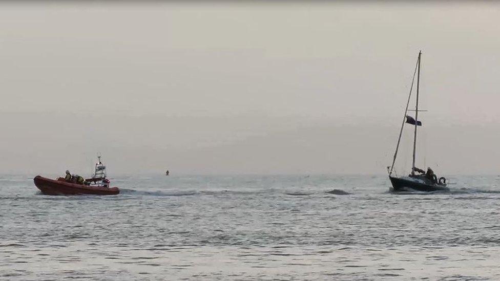 Yacht being towed