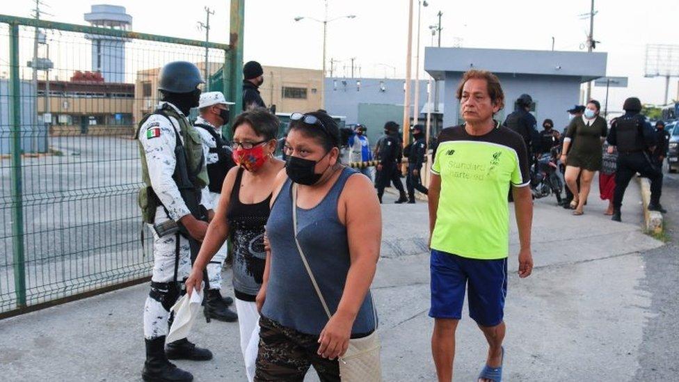 Relatives of inmates stand outside the penitentiary during a fight among inmates in Villahermosa, in Tabasco state, Mexico June 22, 2021