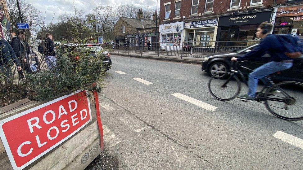 Cyclist on road at busy Hyde Park junction