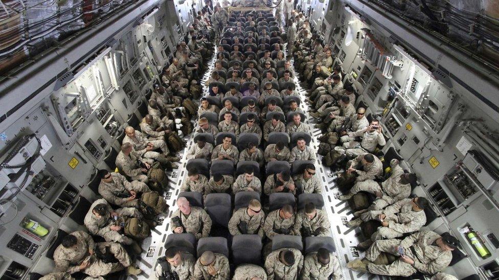 US troops on board a transporter plane in Afghanistan