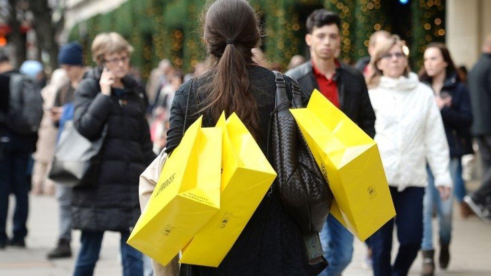 Woman carrying shopping bags