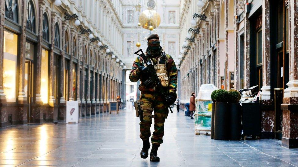 Belgian Army soldier walks through the Galleries Royal Saint-Hubert in the centre of Brussels.