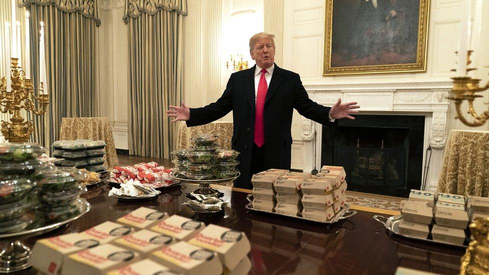 Donald Trump with a table full of fast food