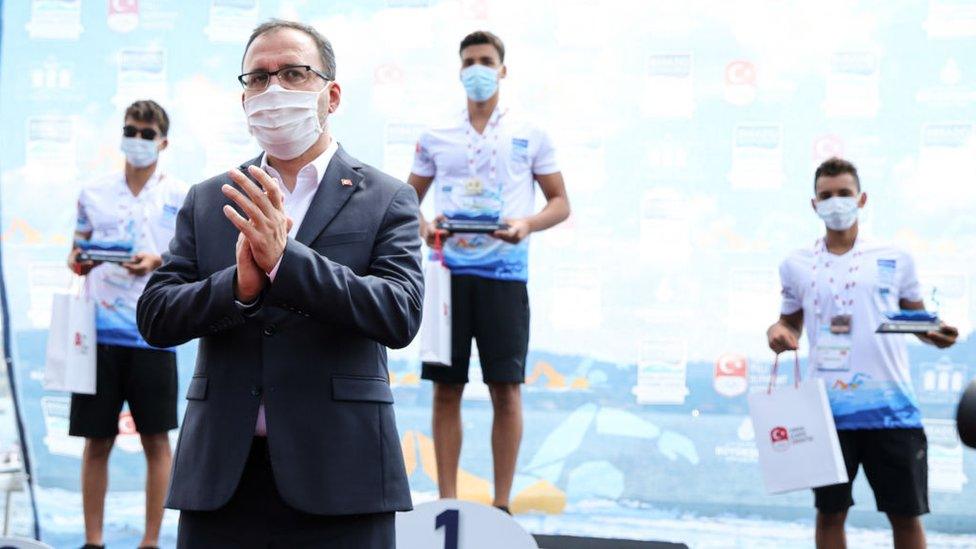 Turkish Youth and Sports Minister Mehmet Muharrem Kasapoglu (Front) congratulates the winners of the race