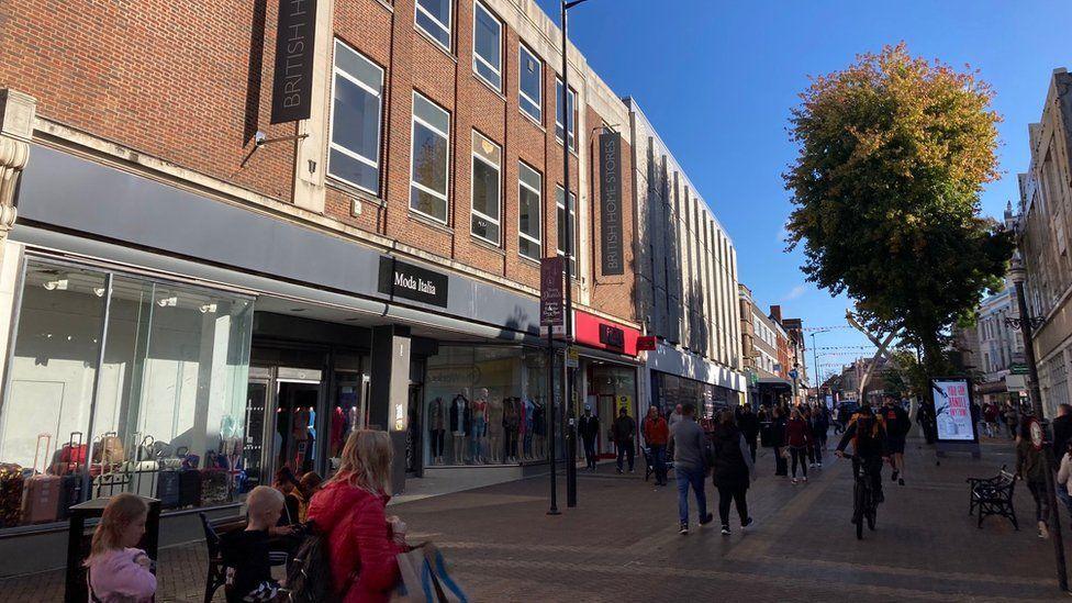 Old department store building in busy shopping street