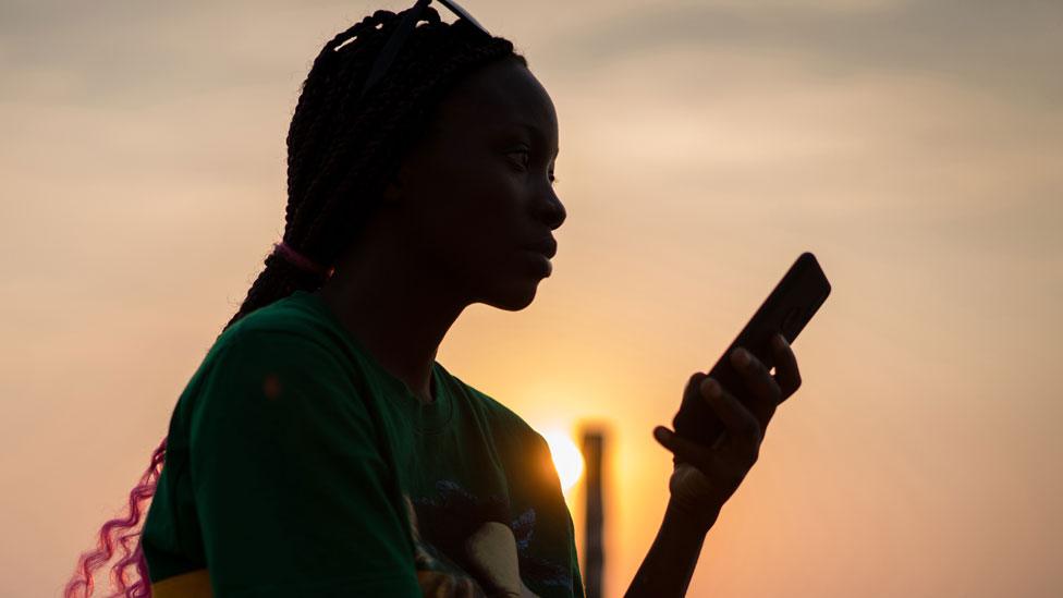 A woman looking at her mobile phone