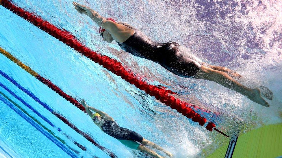 underwater photograph of swimmers competing at the commonwealth games in 2018