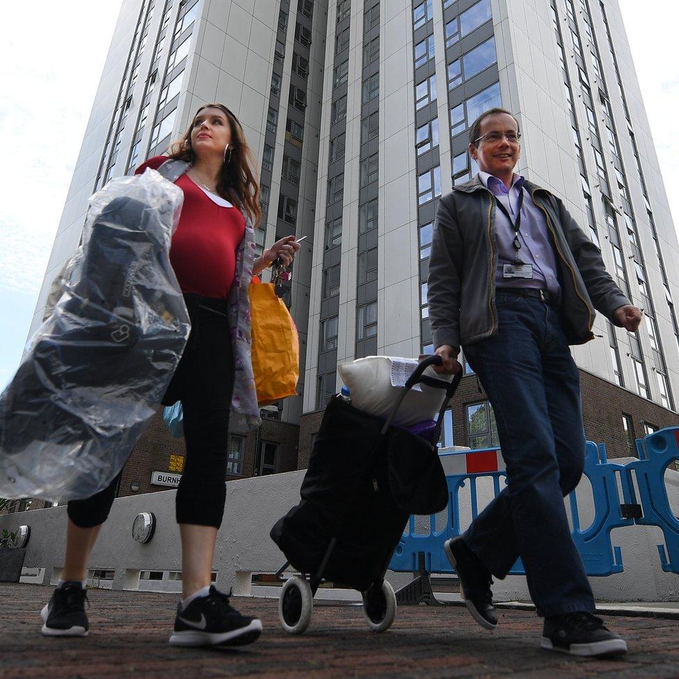 Residents leaving the Chalcots Estate in Camden, when the building was briefly evacuated over concerns about fire safety