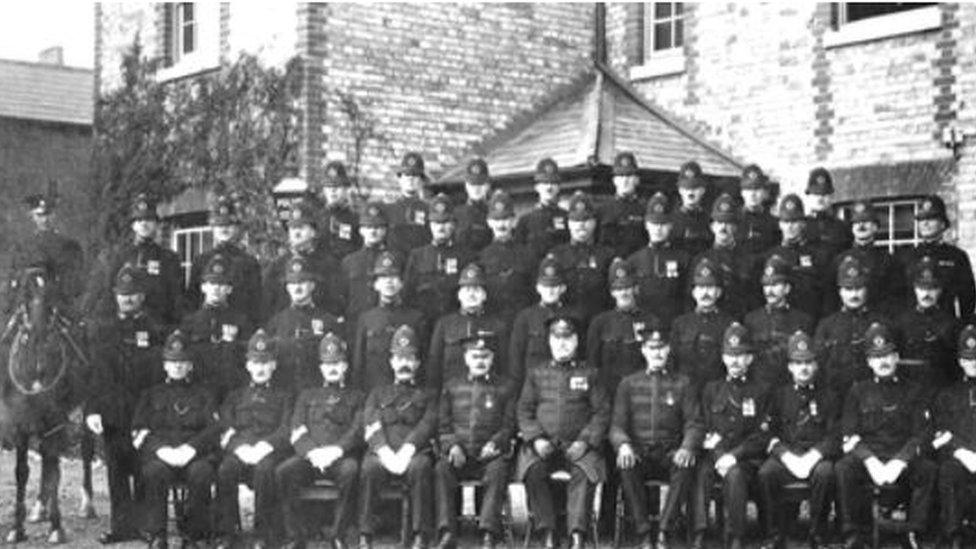 PC Albert Alexander stands next to the mounted police officer, second row from the top