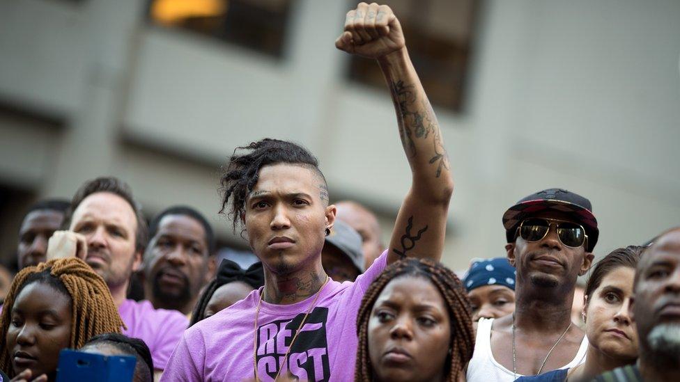 Activists rally in support of NFL quarterback Colin Kaepernick outside the offices of the National Football League on Park Avenue, August 23, 2017 in New York City.