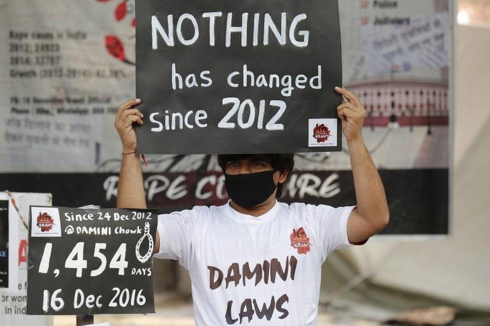 An Indian activist holds placards as he takes part in a protest to mark fourth anniversary of the Delhi gang rape crime, at Jantar Mantar in New Delhi, India, 16 December 2016