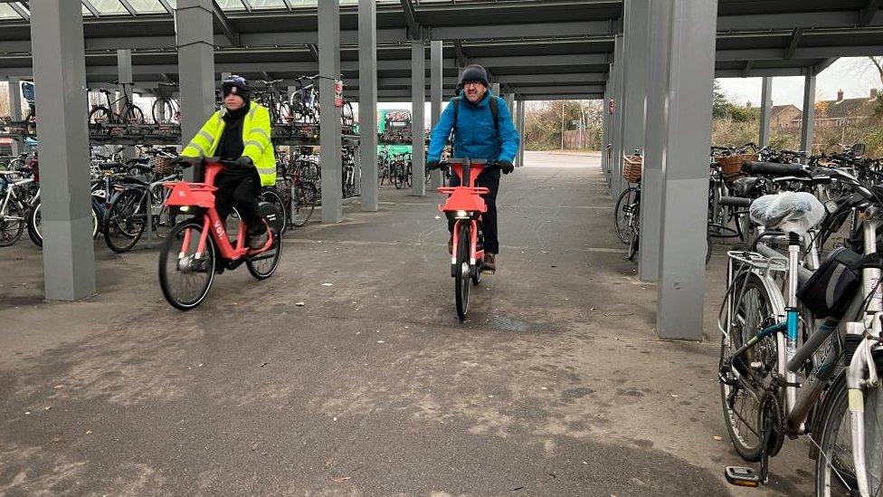 Nik Johnson and Chris Boardman on bikes