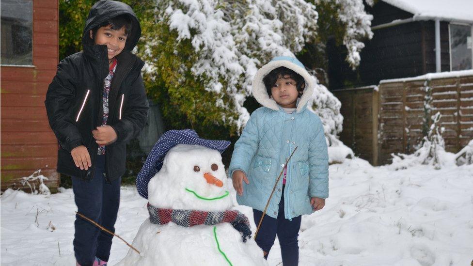 Two children and a snowman