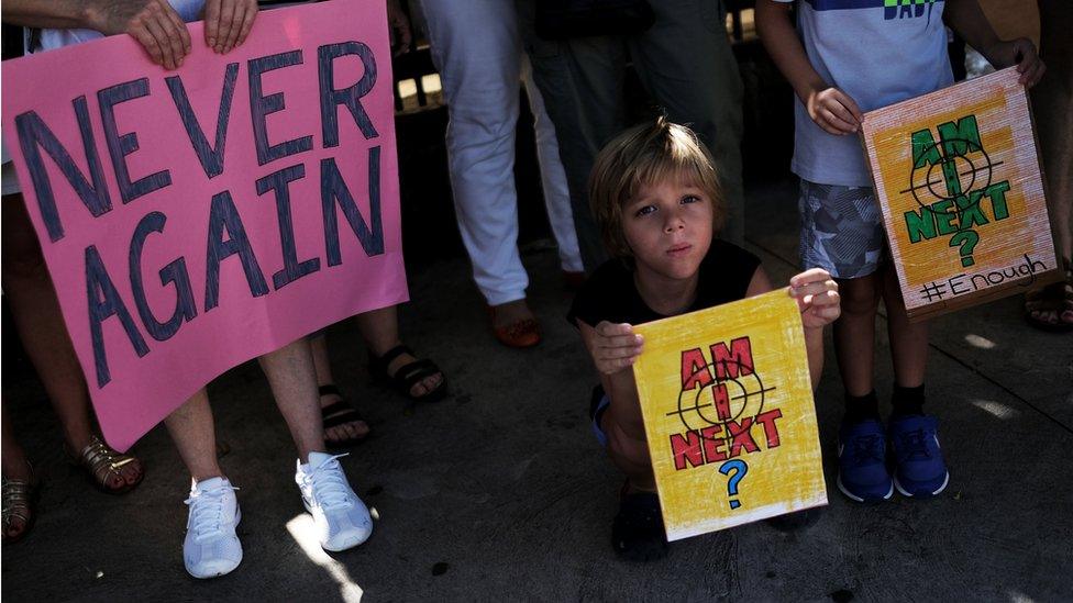 People take part in the "March for Our Lives", an organized demonstration to end gun violence in the United States, outside the U.S. Consulate in Sao Paulo, Brazil