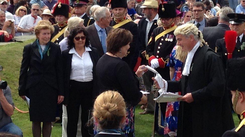 Petition being handed over to the Clerk of Tynwald