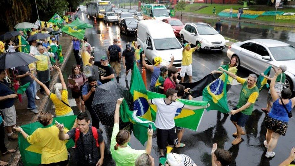 People celebrate after a Brazilian appeals court upheld the corruption conviction of former President Luiz Inacio Lula da Silva, in Porto Alegre, Brazil January 24, 2018.