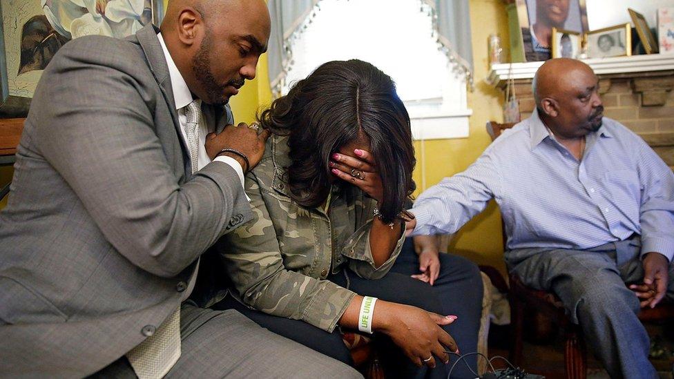 Tiffany Crutcher, twin sister of Terence Crutcher , centre, with her father Joey Crutcher (right) and lawyer Damario Solomon-Simmons