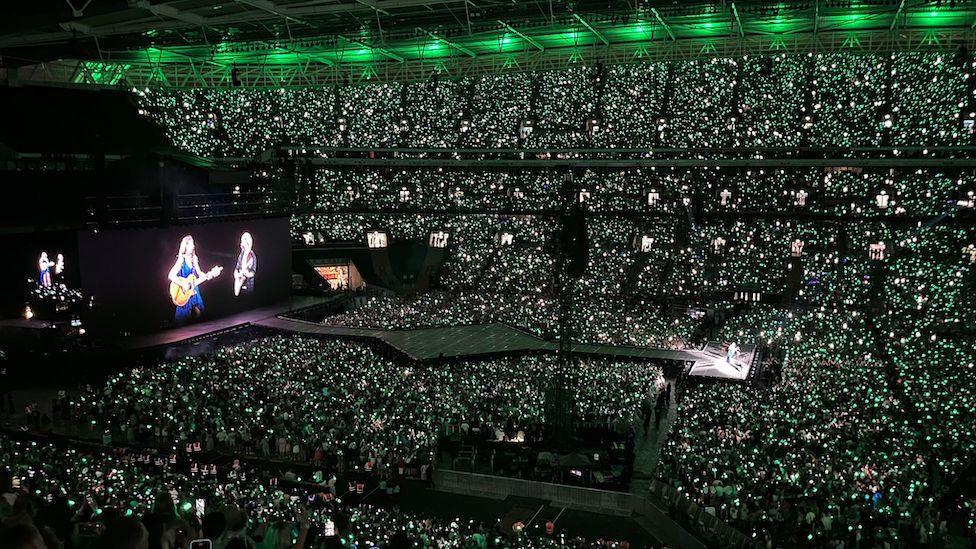 Taylor Swift performing with Ed Sheeran at Wembley Stadium.