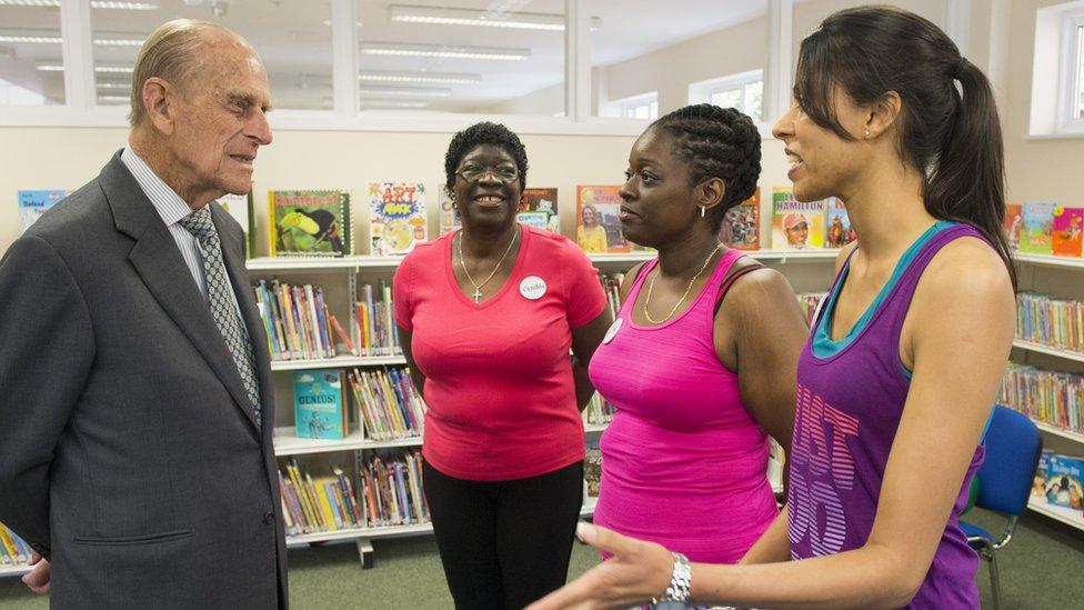 Prince Philip and volunteers at an east London community centre