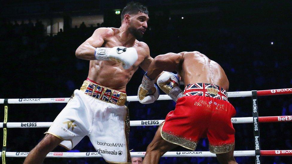 Amir Khan fighting Kell Brook in the boxing ring