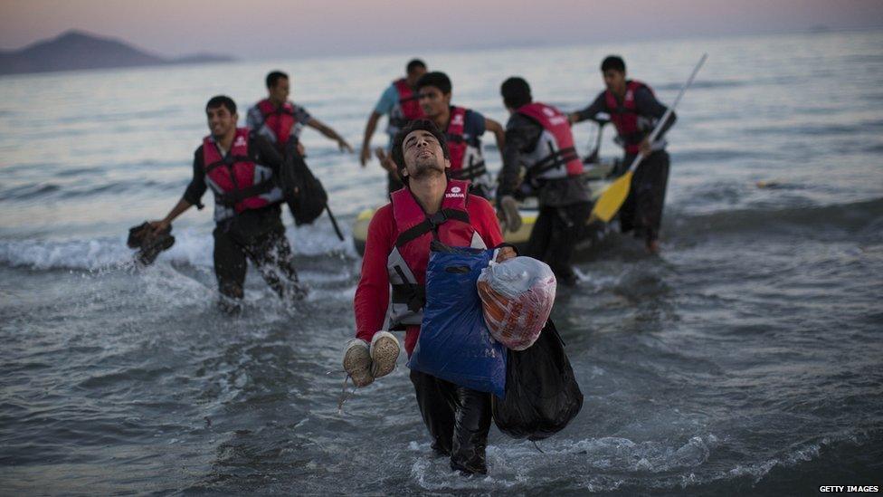 Migrants from Pakistan come ashore on the Greek island of Kos, 31 Aug 15