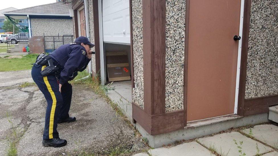 Police search homes in the Gillam area of Manitoba, on 28 July 2019