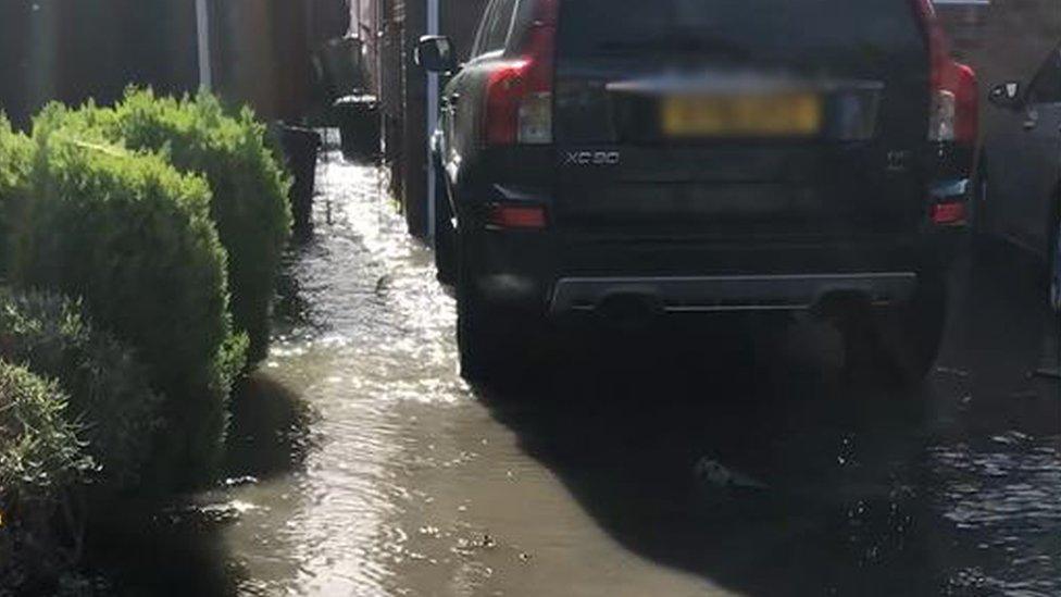 Aziz Miah's flooded driveway