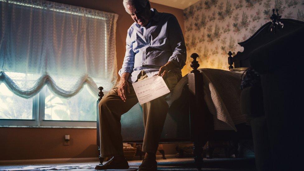 Elderly man on bed