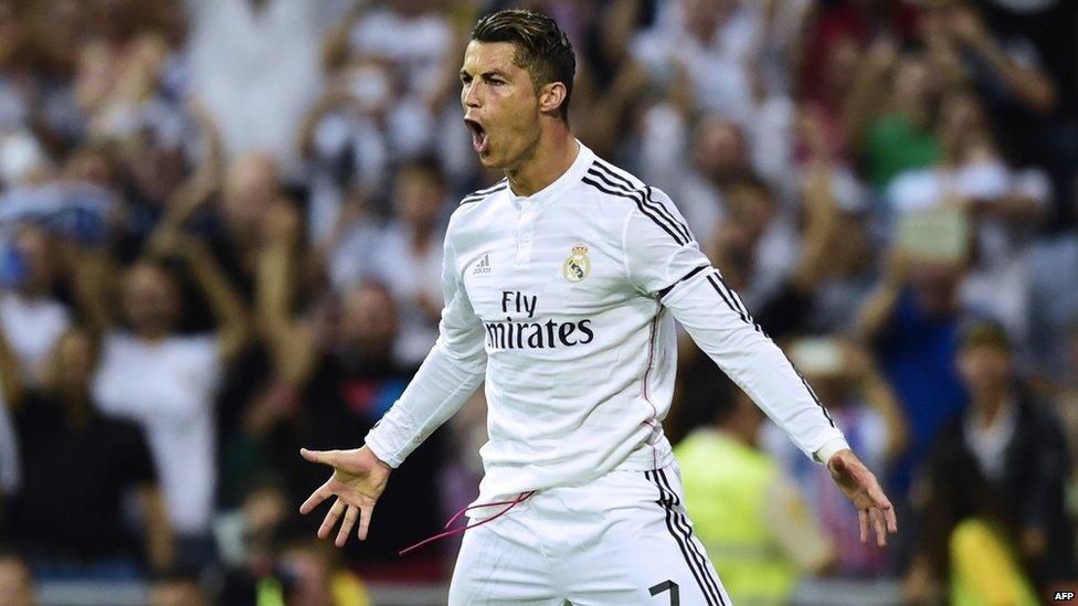 Real Madrid"s Portuguese forward Cristiano Ronaldo celebrating after scoring a penalty