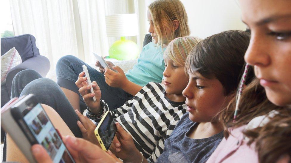 Children using phones - stock shot