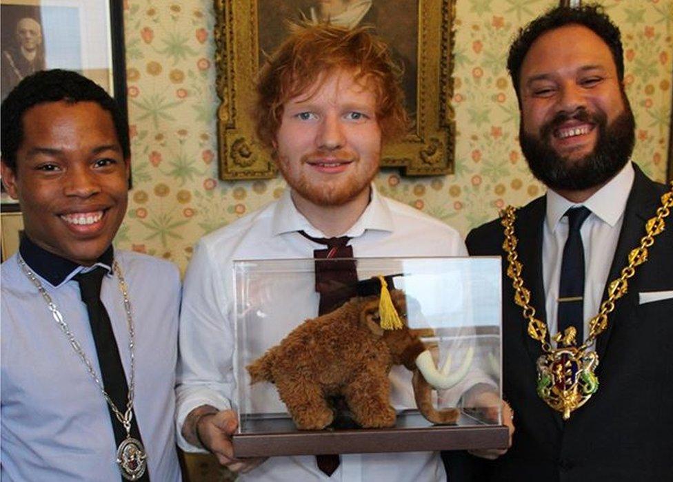 Ed Sheeran is presented with a toy mammoth